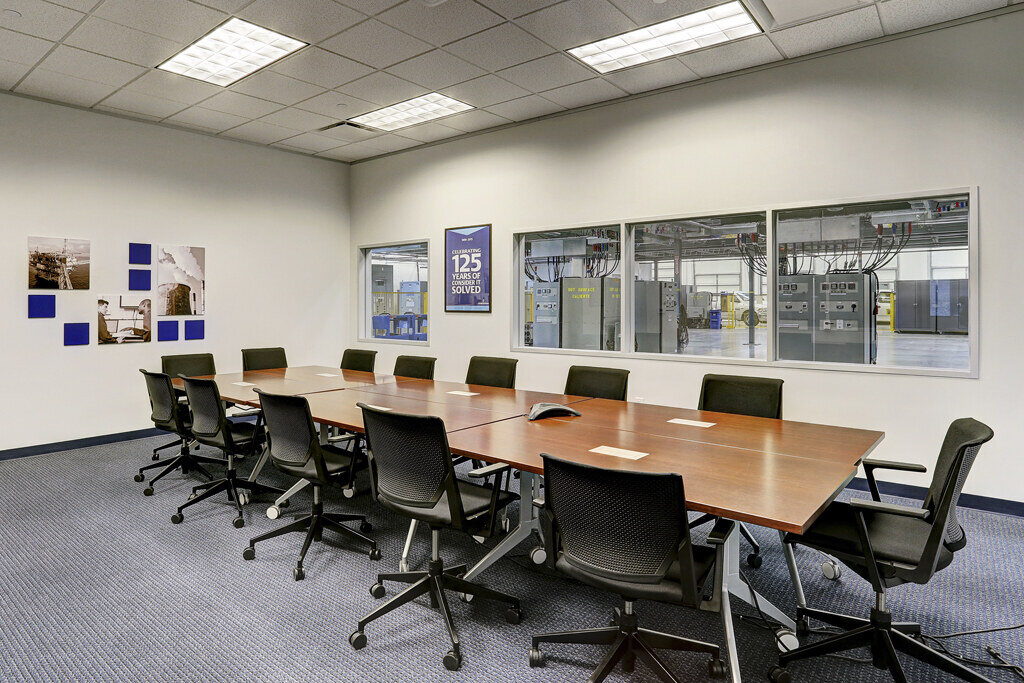 Spacious industrial workspace at Emerson Network Power office in Houston, TX, with visible equipment stations