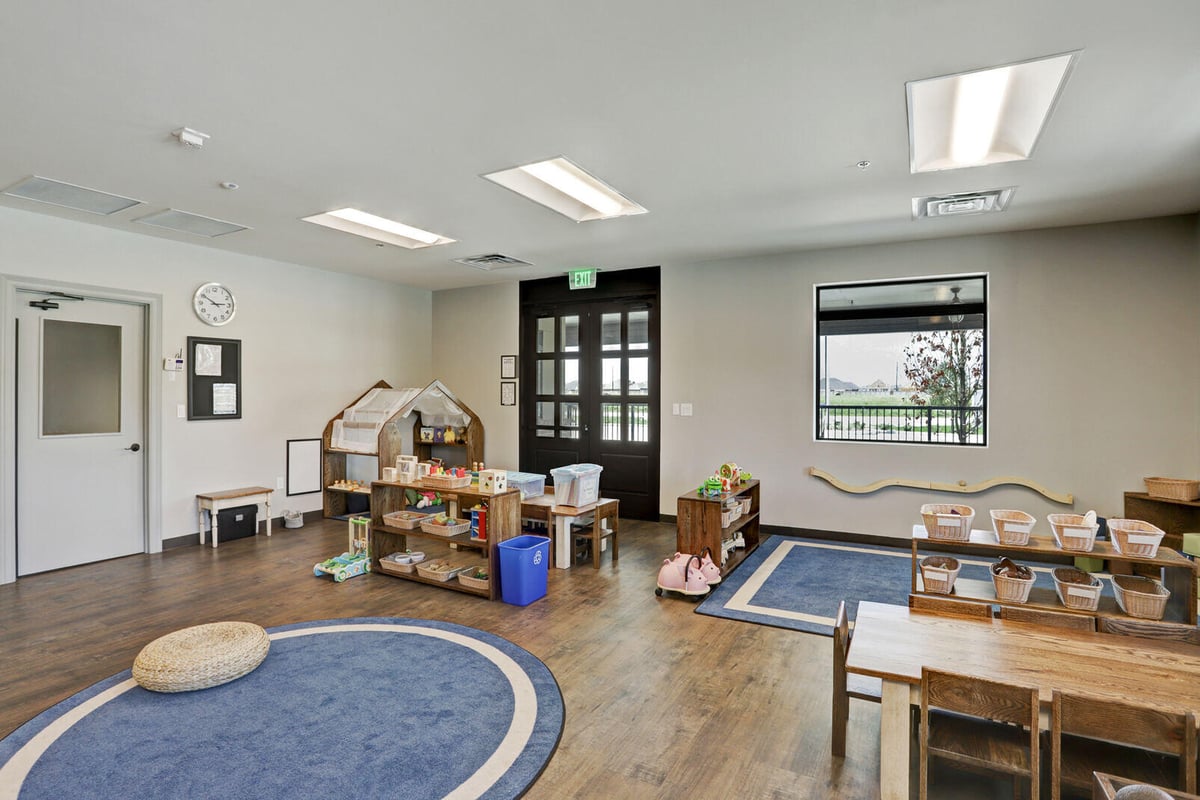 Brick-accented hallway with decorative signs for Sprouts and Pips, part of a GSD Construction renovation in Houston, TX
