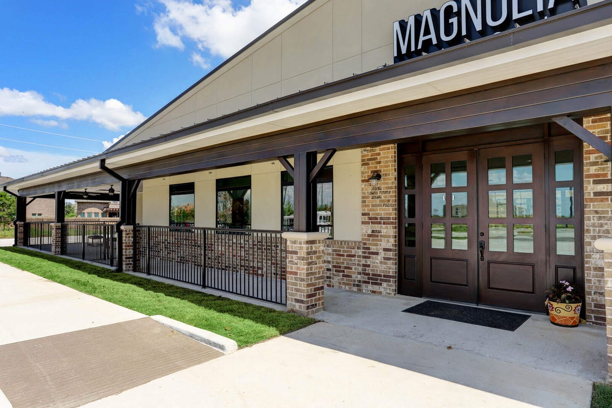 Commercial property porch with rustic brick accents and sleek design by GSD Construction in Houston, TX