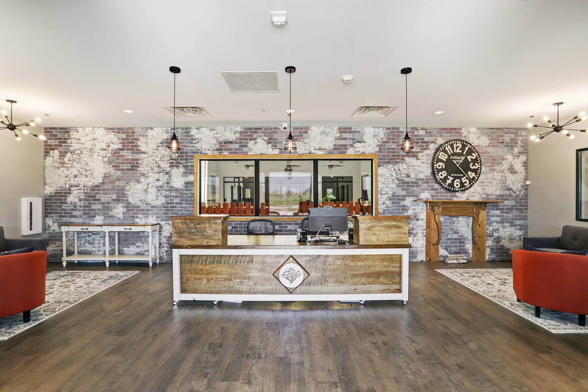 Modern commercial interior with a reception desk and industrial-style decor by GSD Construction in Houston, TX