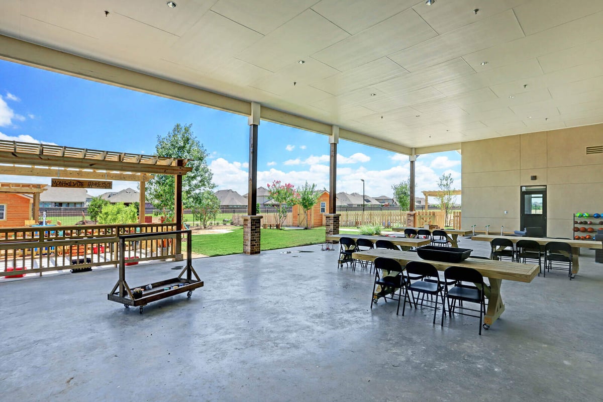 Open-air pavilion with tables, seating, and landscaped surroundings, part of GSD Construction’s Houston, TX project