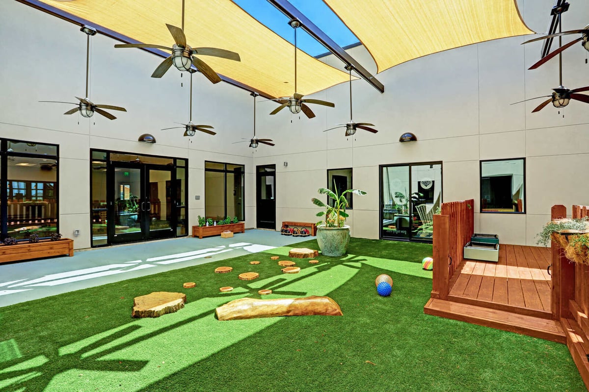 Renovated outdoor courtyard space with greenery, part of GSD Constructions project in Houston, TX