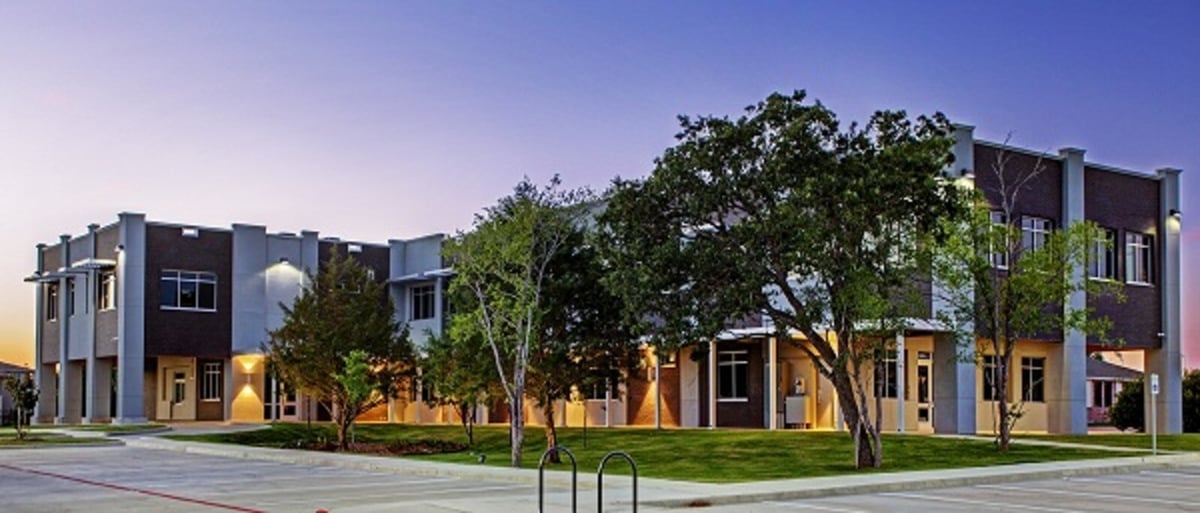 Twilight view of a modern commercial renovation project completed by GSD Construction in Houston, TX